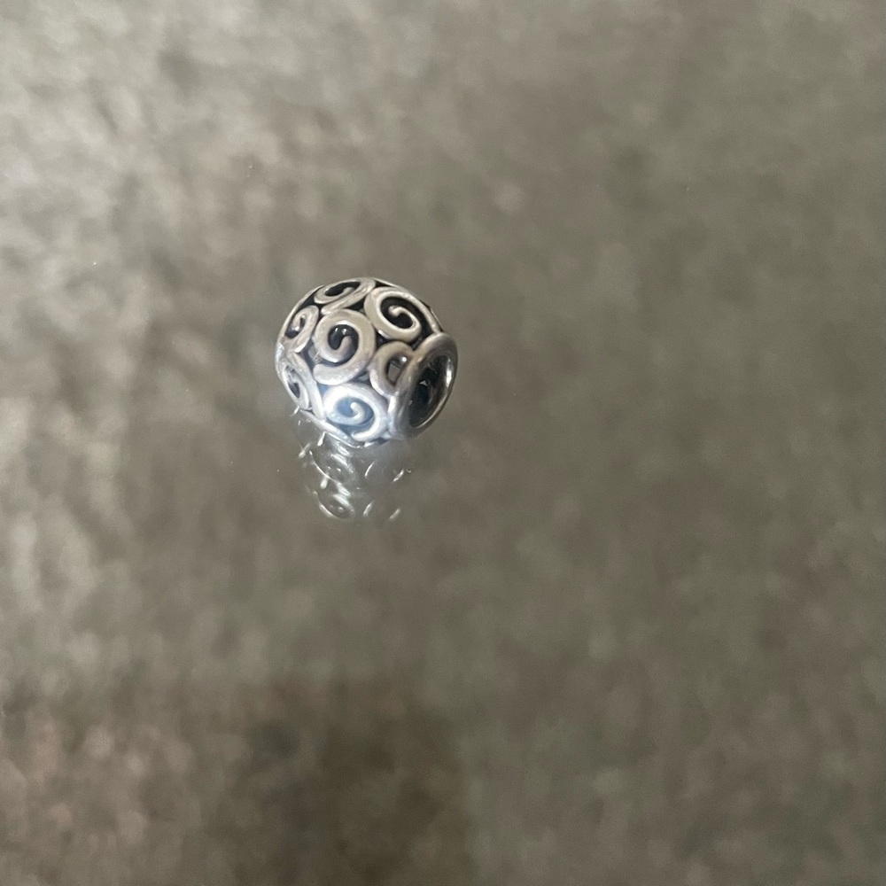 Openwork swirl pandora charm
